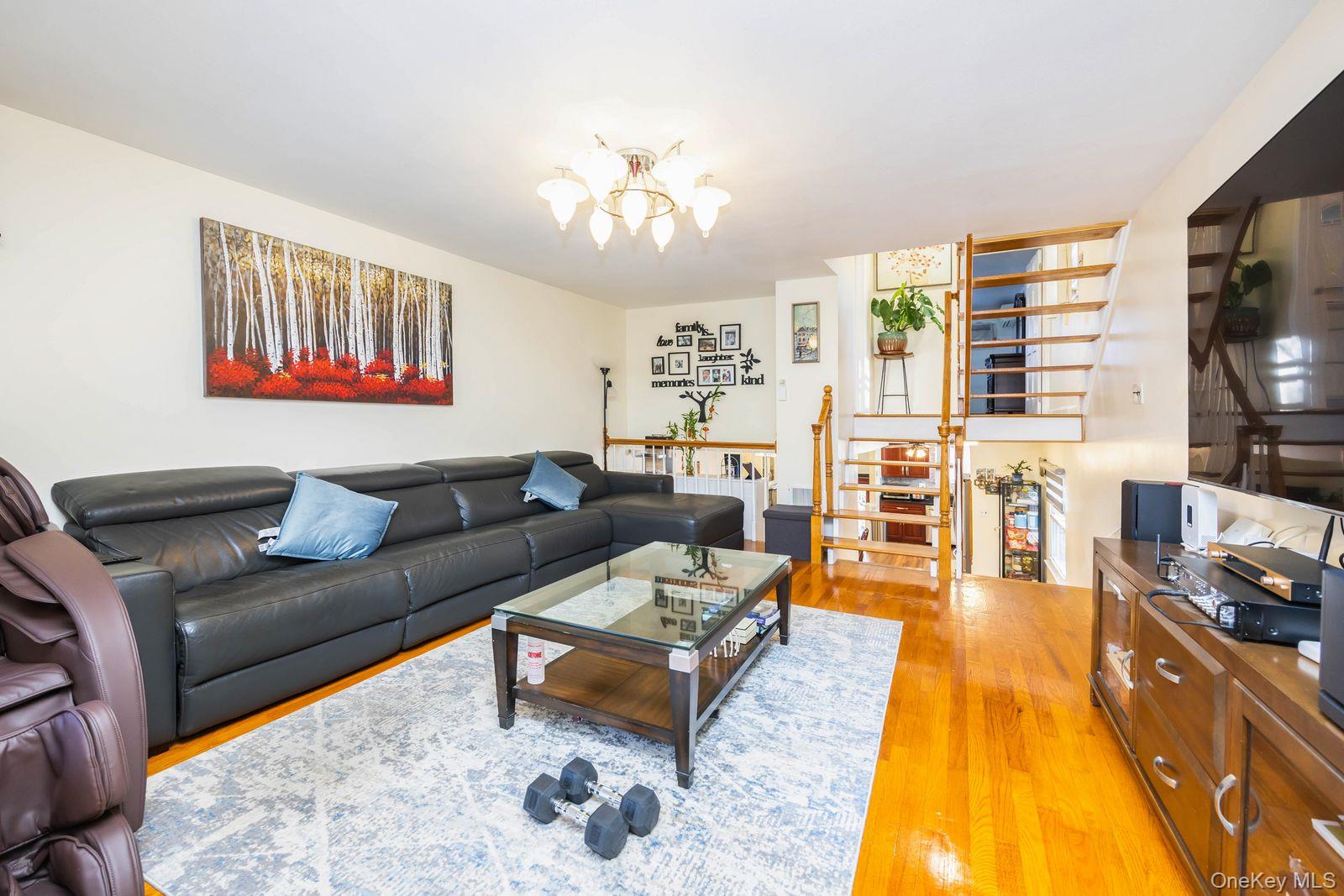197 Park Drive North Staten Island, NY 10314 - Photo 22 of 37 a living room with furniture and a flat screen tv