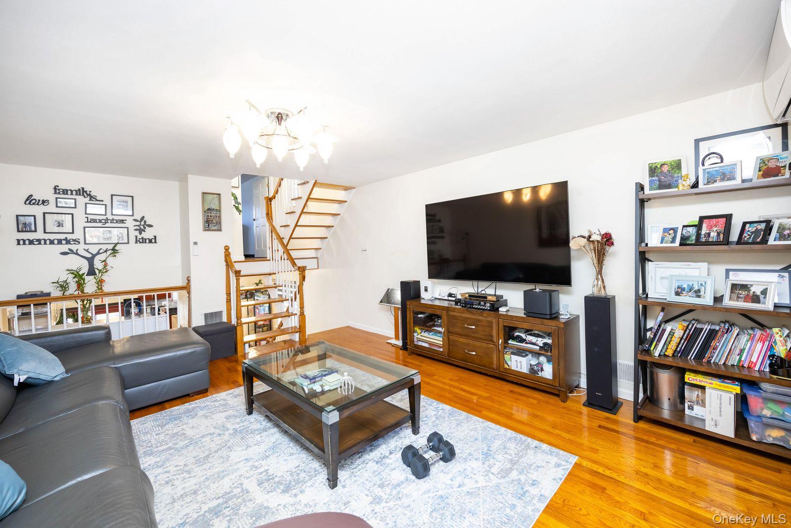 197 Park Drive North Staten Island, NY 10314 - Photo 23 of 37 a living room with furniture and a flat screen tv