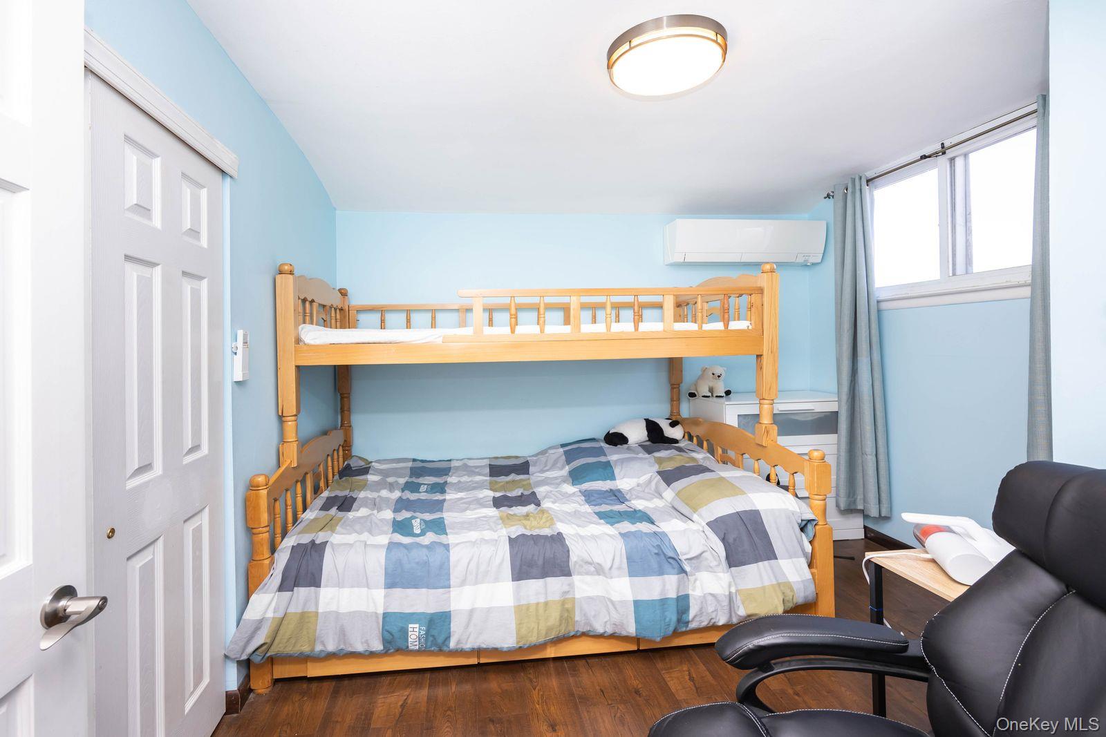 197 Park Drive North Staten Island, NY 10314 - Photo 30 of 37 a bedroom with a bed and window