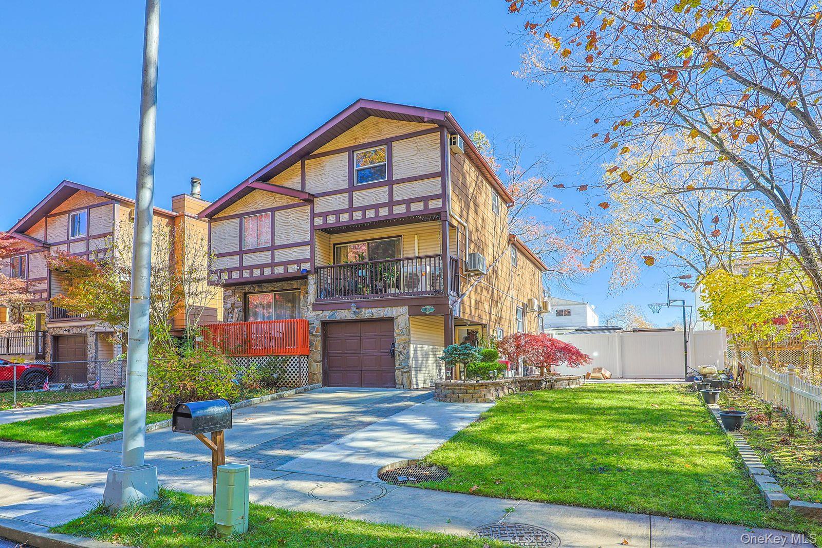 197 Park Drive North Staten Island, NY 10314 - Photo 3 of 37 a front view of a building with garden