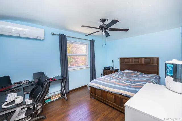 a bedroom with a bed and a table in it