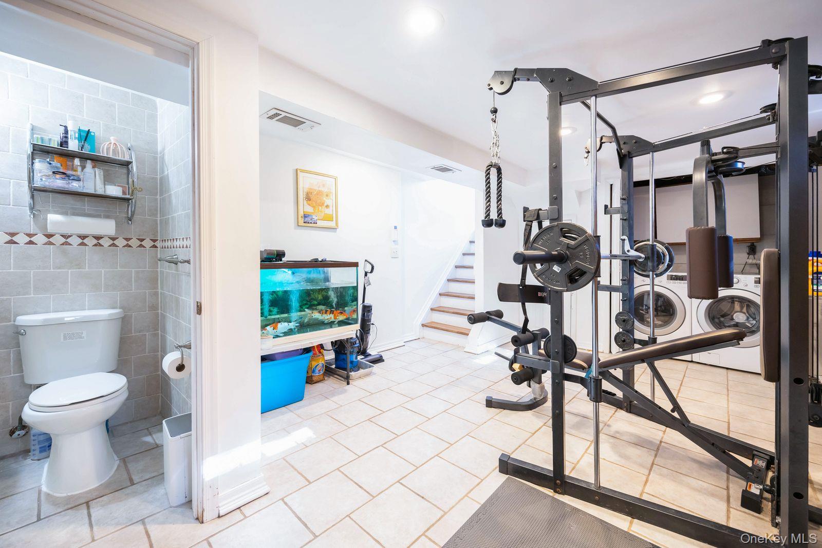 197 Park Drive North Staten Island, NY 10314 - Photo 32 of 37 a view of a hallway with wooden floor and furniture