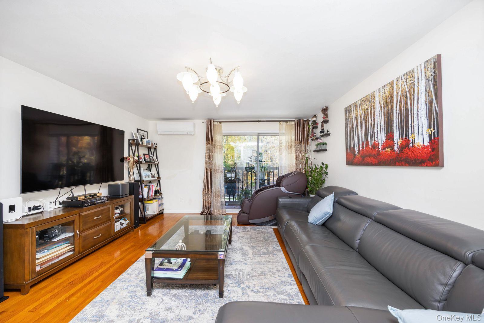 197 Park Drive North Staten Island, NY 10314 - Photo 36 of 37 a living room with furniture and a flat screen tv