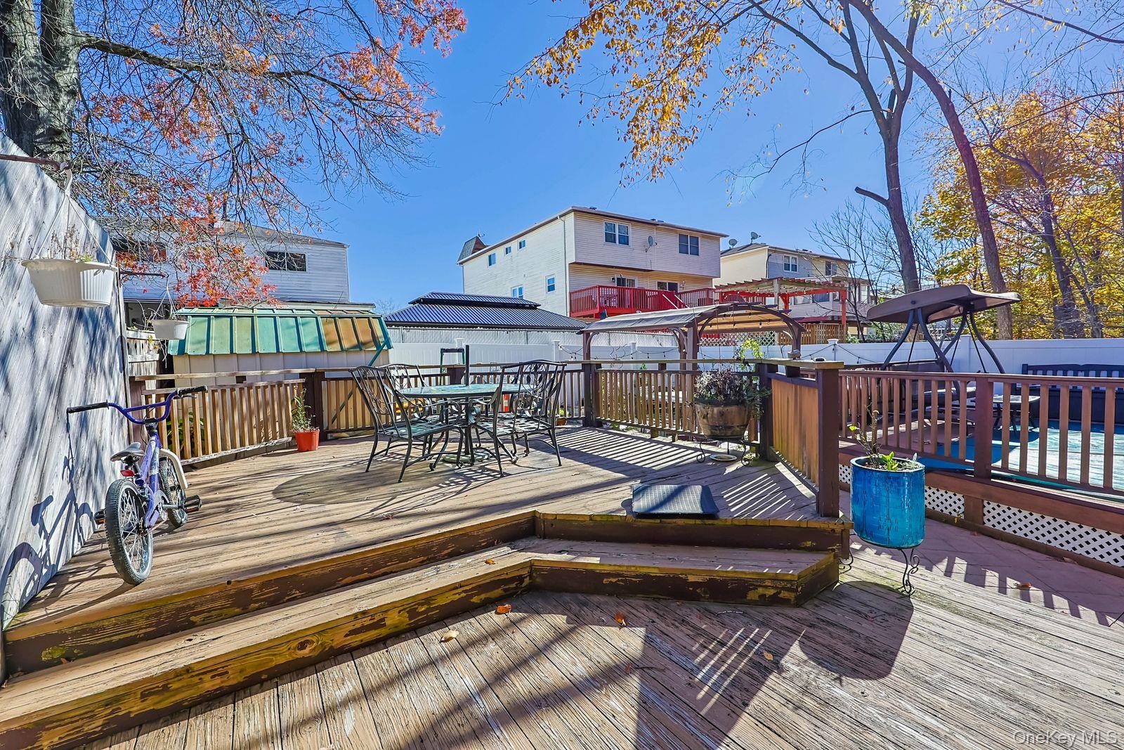 197 Park Drive North Staten Island, NY 10314 - Photo 9 of 37 a view of a chairs with wooden deck