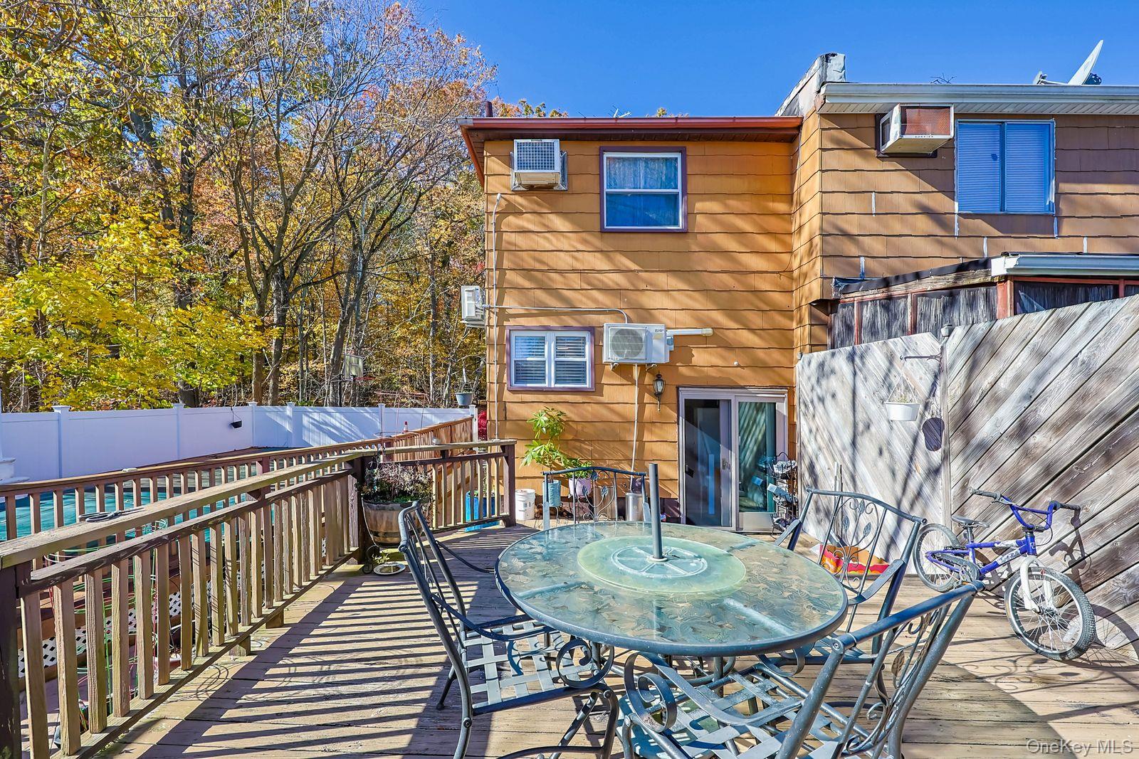 197 Park Drive North Staten Island, NY 10314 - Photo 10 of 37 a balcony with table and chairs
