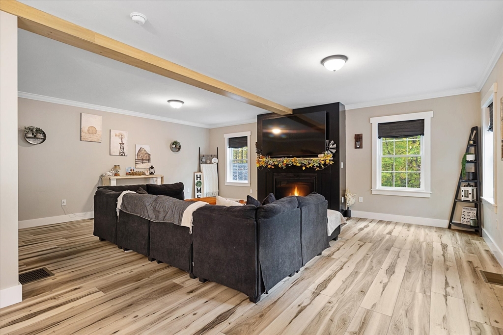 1015 Willis Road Phillipston, MA 01331 - Photo 20 of 42 a living room with furniture and a fireplace