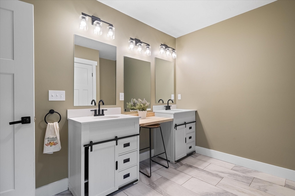1015 Willis Road Phillipston, MA 01331 - Photo 27 of 42 a spacious bathroom with a double vanity sink mirror and