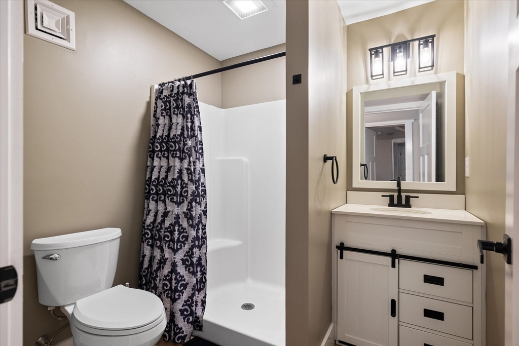 1015 Willis Road Phillipston, MA 01331 - Photo 37 of 42 a bathroom with a sink a toilet and shower