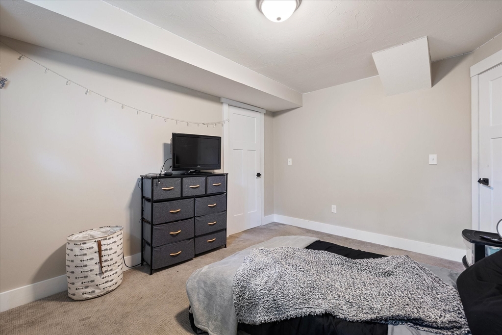 1015 Willis Road Phillipston, MA 01331 - Photo 40 of 42 a bedroom with a bed and couch