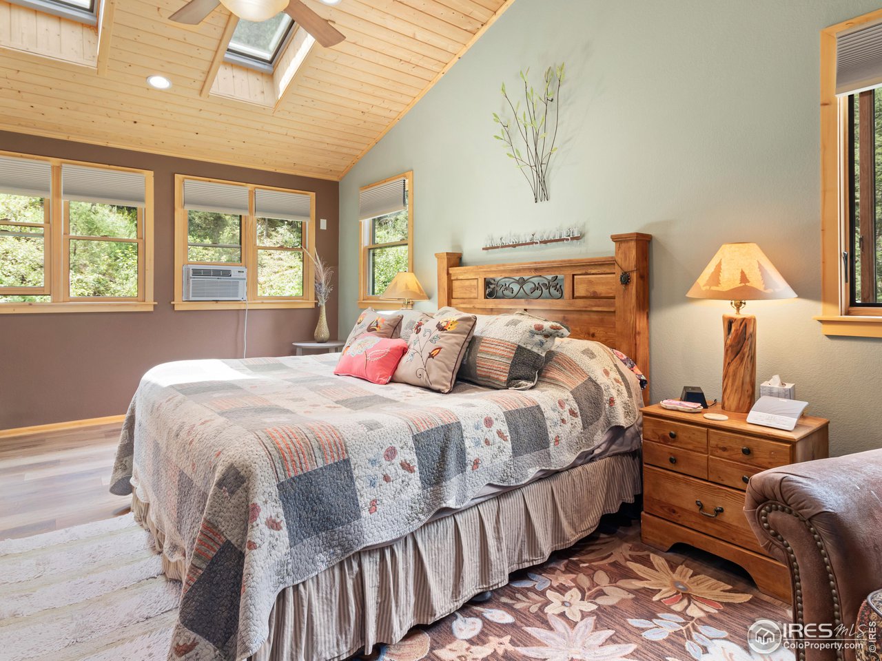 243 Waltonia Road Drake, CO 80515 - Photo 14 of 38 a bedroom with bed and window