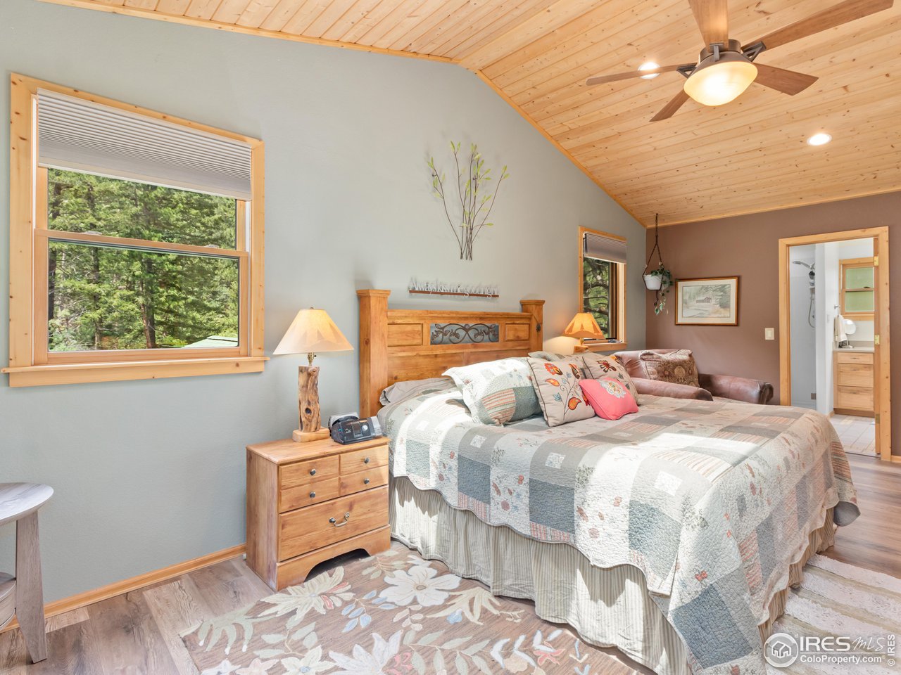 243 Waltonia Road Drake, CO 80515 - Photo 17 of 38 a bedroom with a bed and a window