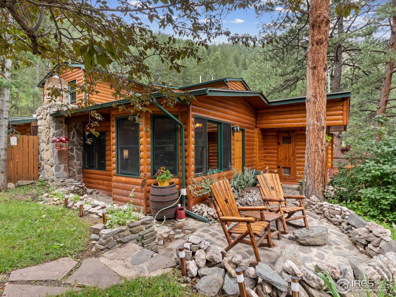 243 Waltonia Road Drake, CO 80515 - Photo 26 of 38 a view of a chairs and table in a backyard