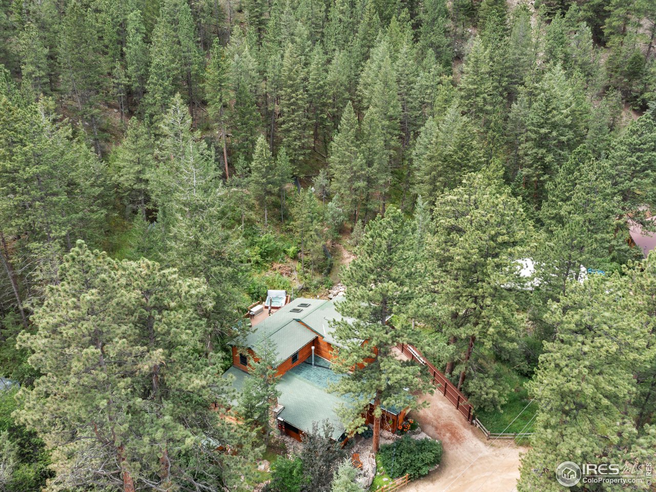 243 Waltonia Road Drake, CO 80515 - Photo 3 of 38 an aerial view of residential house with outdoor space and trees all around