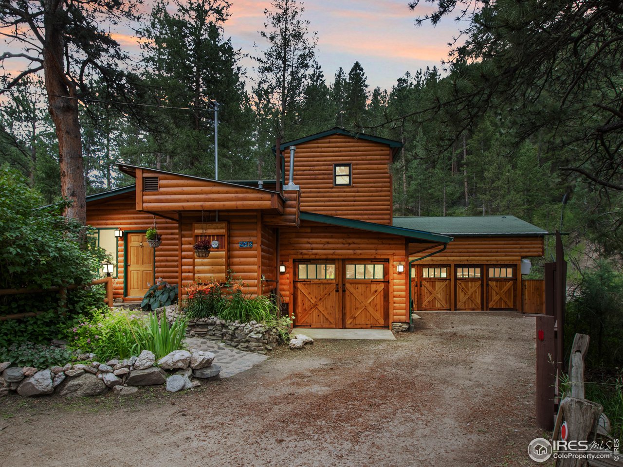 243 Waltonia Road Drake, CO 80515 - Photo 38 of 38 a front view of a house with garden
