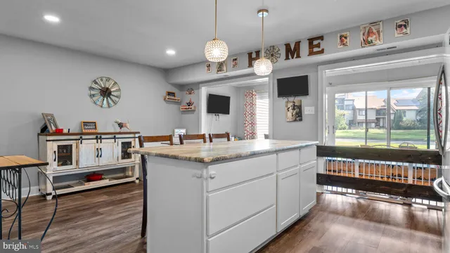 a kitchen with cabinets a sink and appliances