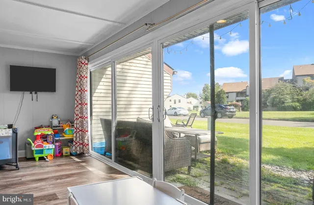 a children room with toys and a floor to ceiling window