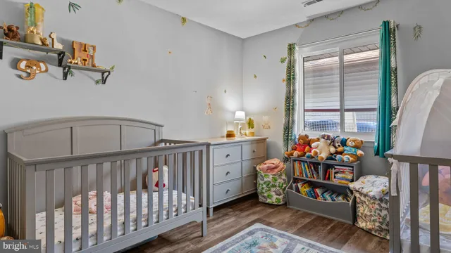 a bedroom with furniture and a window