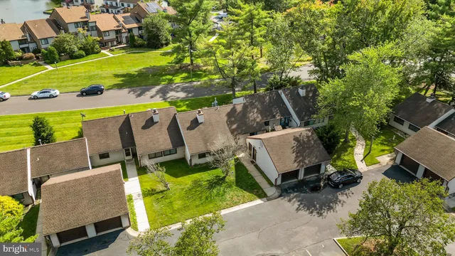 a view of backyard with outdoor seating and green space