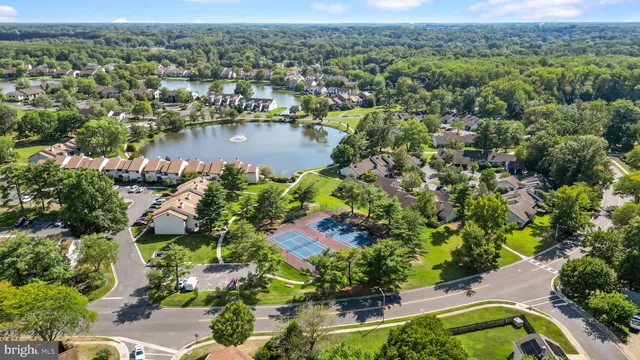 an aerial view of a house with a lake view