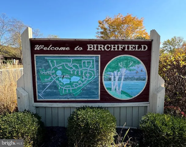 a view of a lake with a bench and lake view