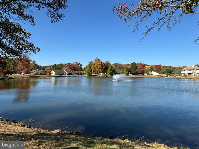 a swimming pool with outdoor seating and yard