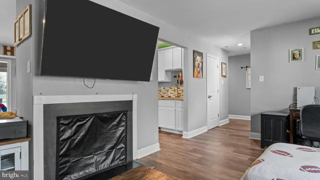 a view of a livingroom with furniture and a fireplace