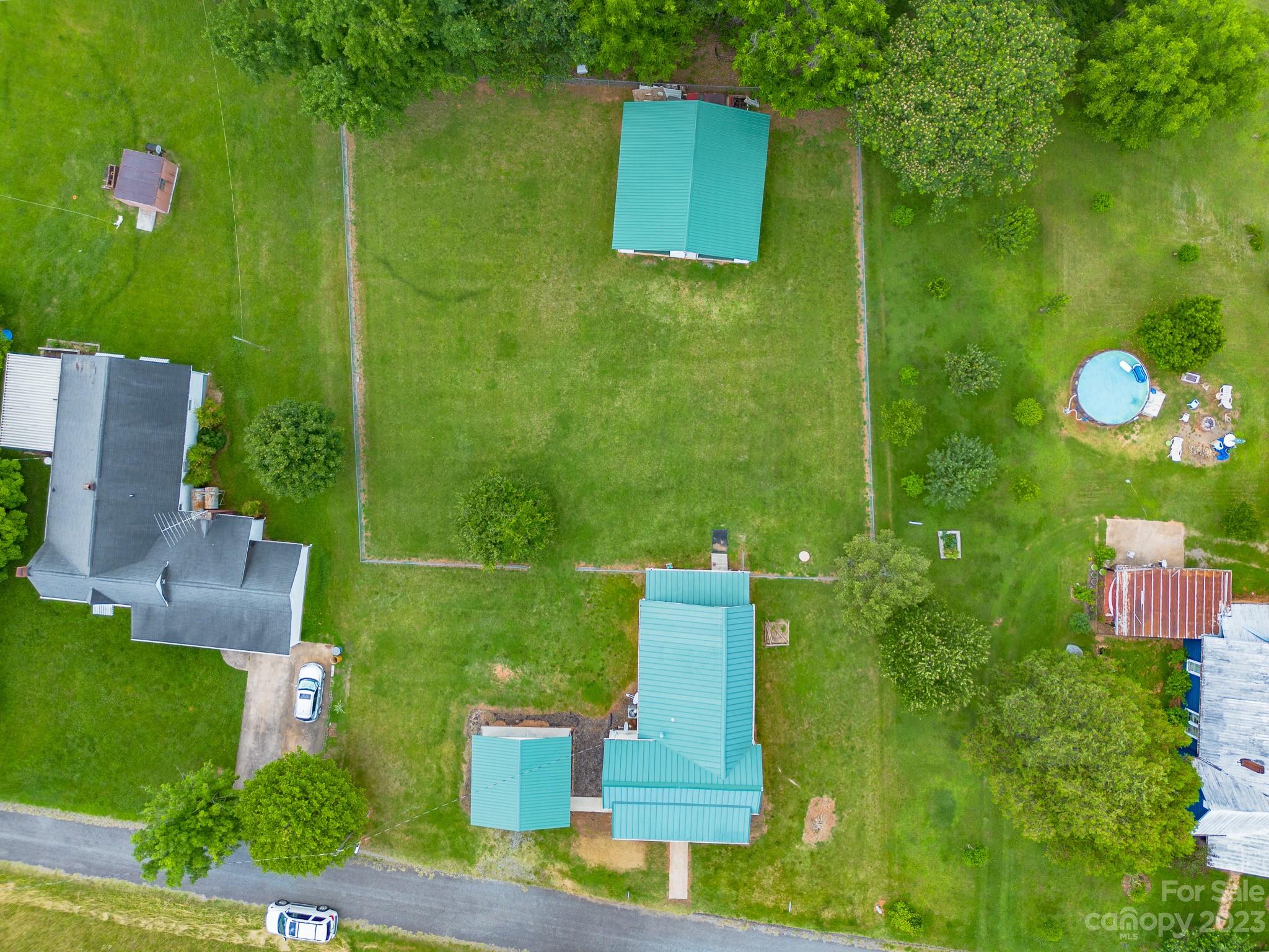 146 Sorrells Road Rutherfordton, NC 28139 - Photo 14 of 25 an aerial view of a house with a yard basket ball court and outdoor seating