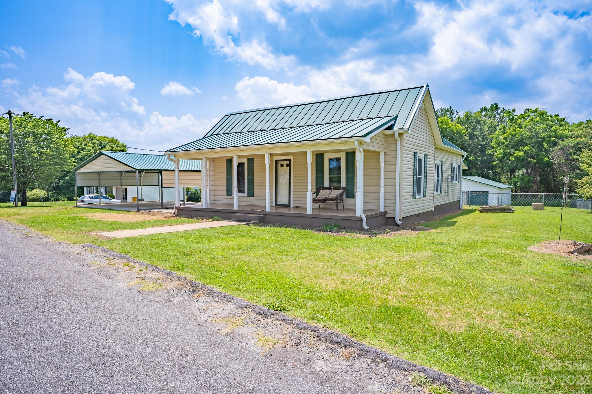 146 Sorrells Road Rutherfordton, NC 28139 - Photo 16 of 25 a front view of a house with garden