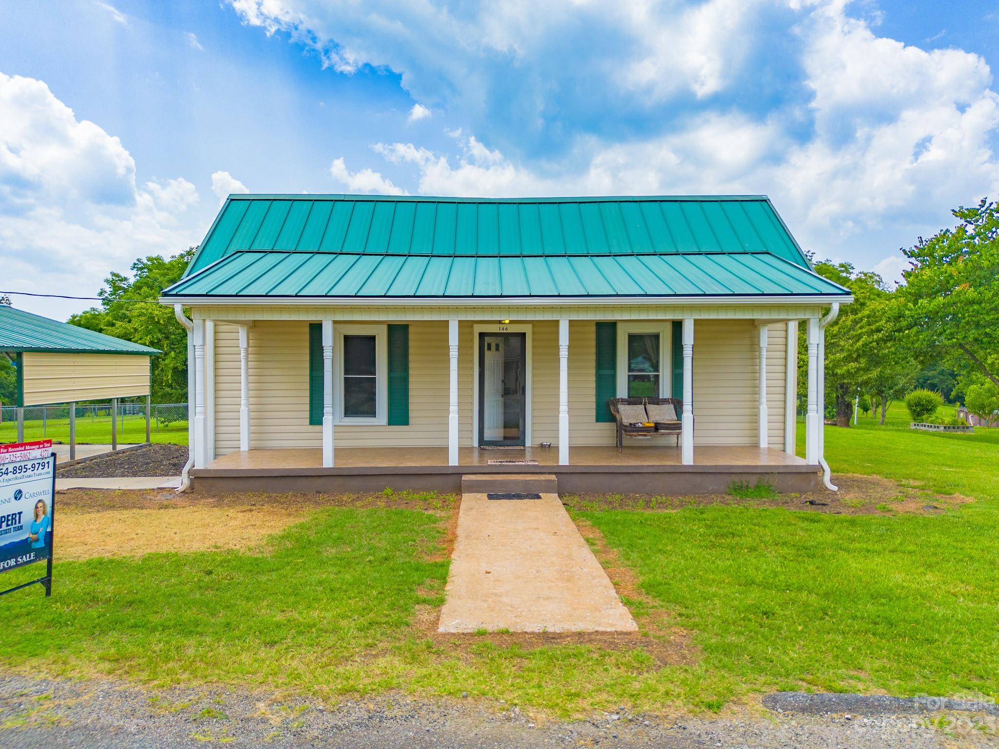 146 Sorrells Road Rutherfordton, NC 28139 - Photo 21 of 25 a view of a house with a yard
