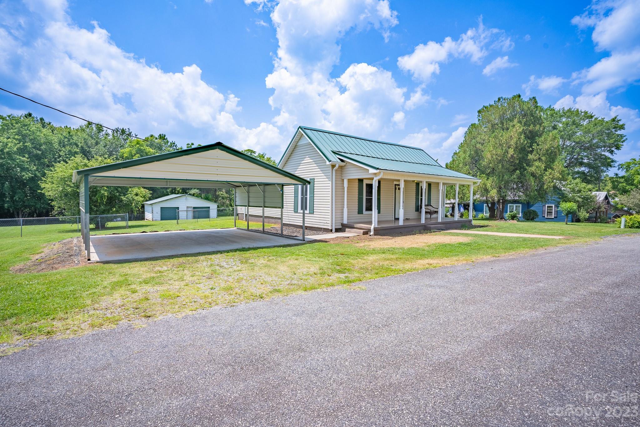 146 Sorrells Road Rutherfordton, NC 28139 - Photo 23 of 25 a view of house with outdoor space and swimming pool