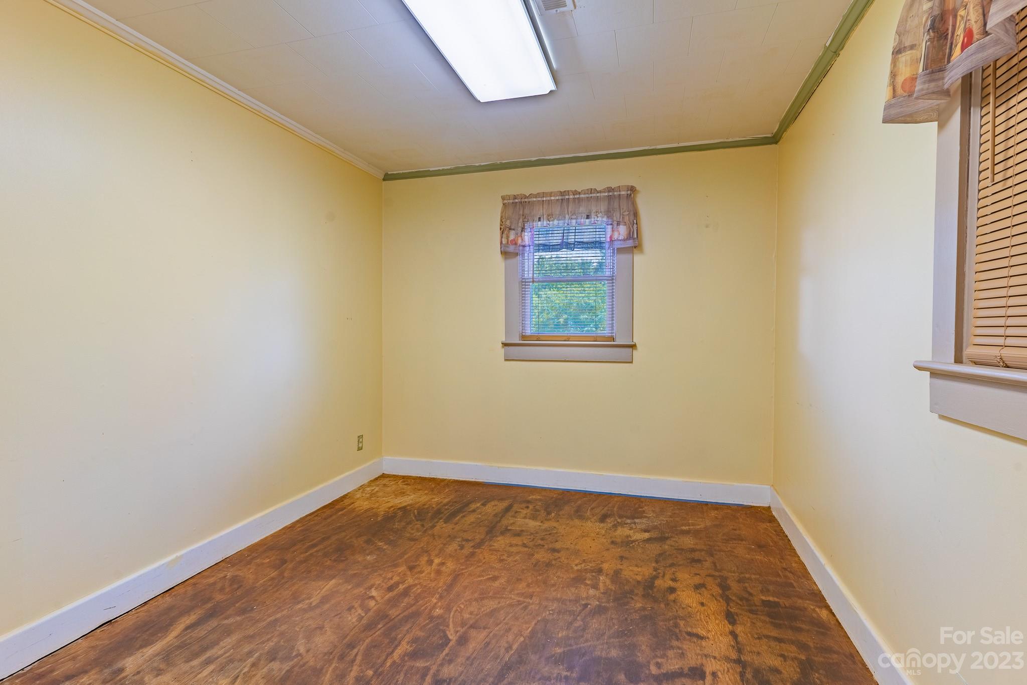 146 Sorrells Road Rutherfordton, NC 28139 - Photo 9 of 25 an empty room with a window