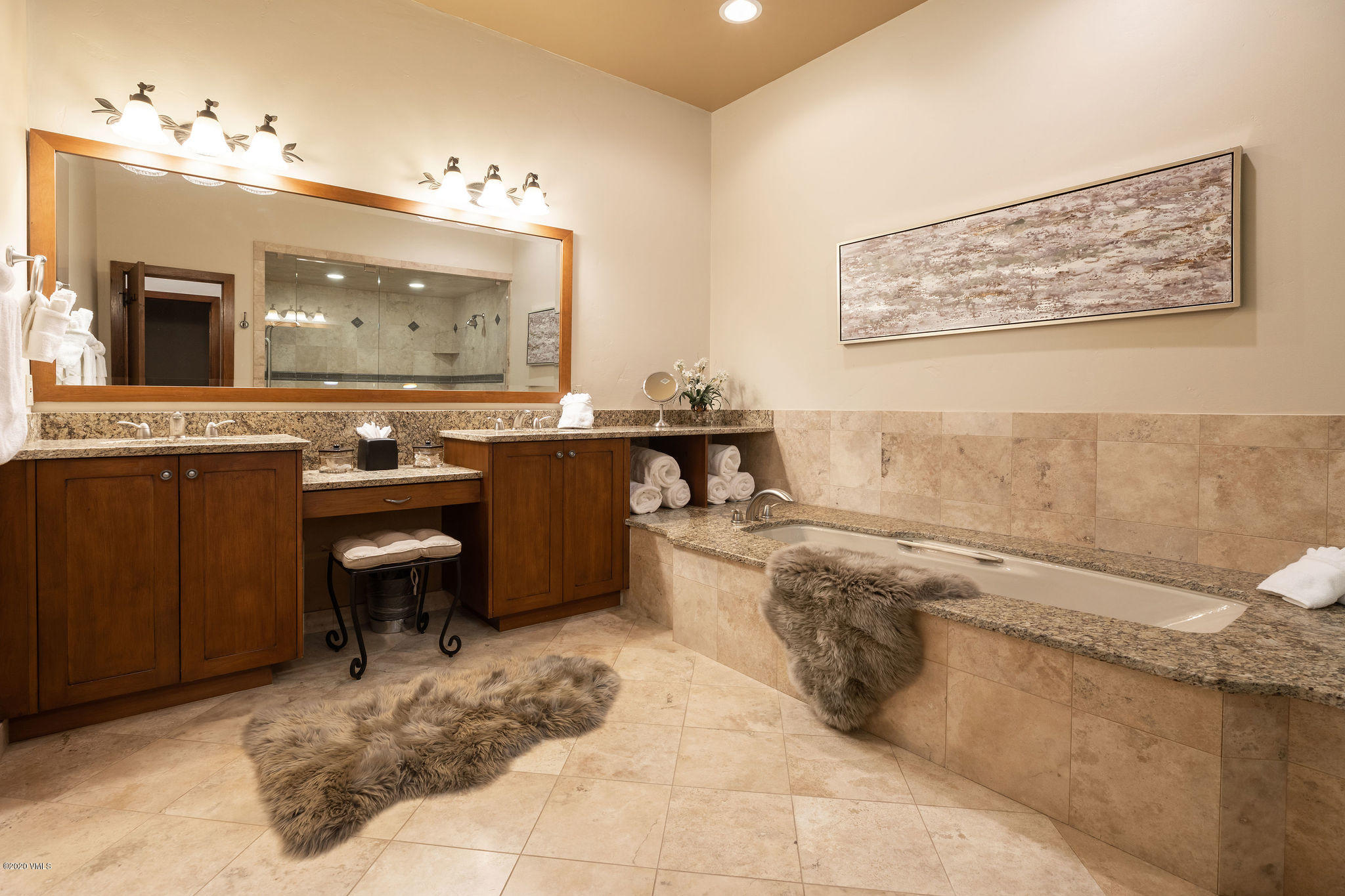 10 Bachelor Gulch Road Beaver Creek, CO 81620 - Photo 11 of 19 a spacious bathroom with a tub sink and mirror