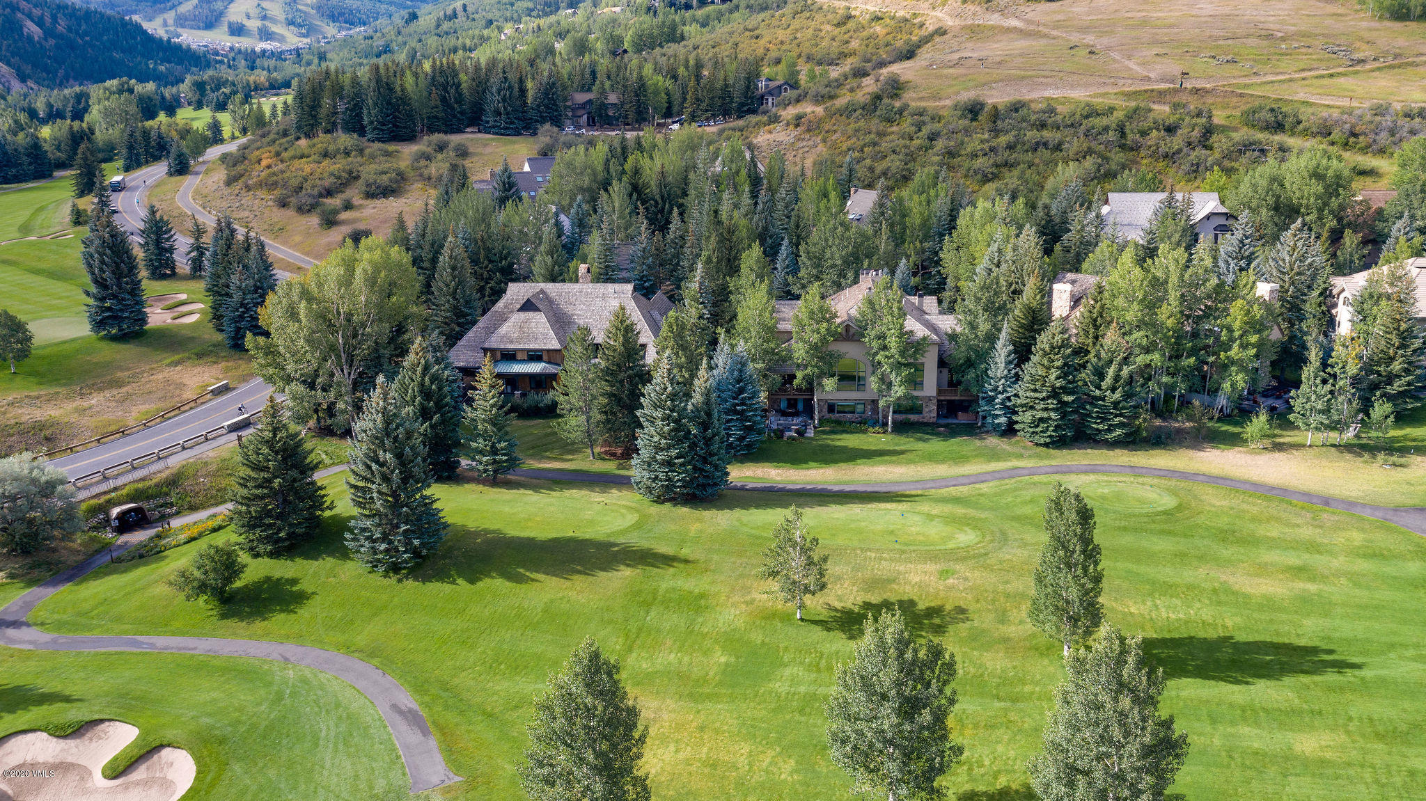 10 Bachelor Gulch Road Beaver Creek, CO 81620 - Photo 15 of 19 a view of a swimming pool with a yard