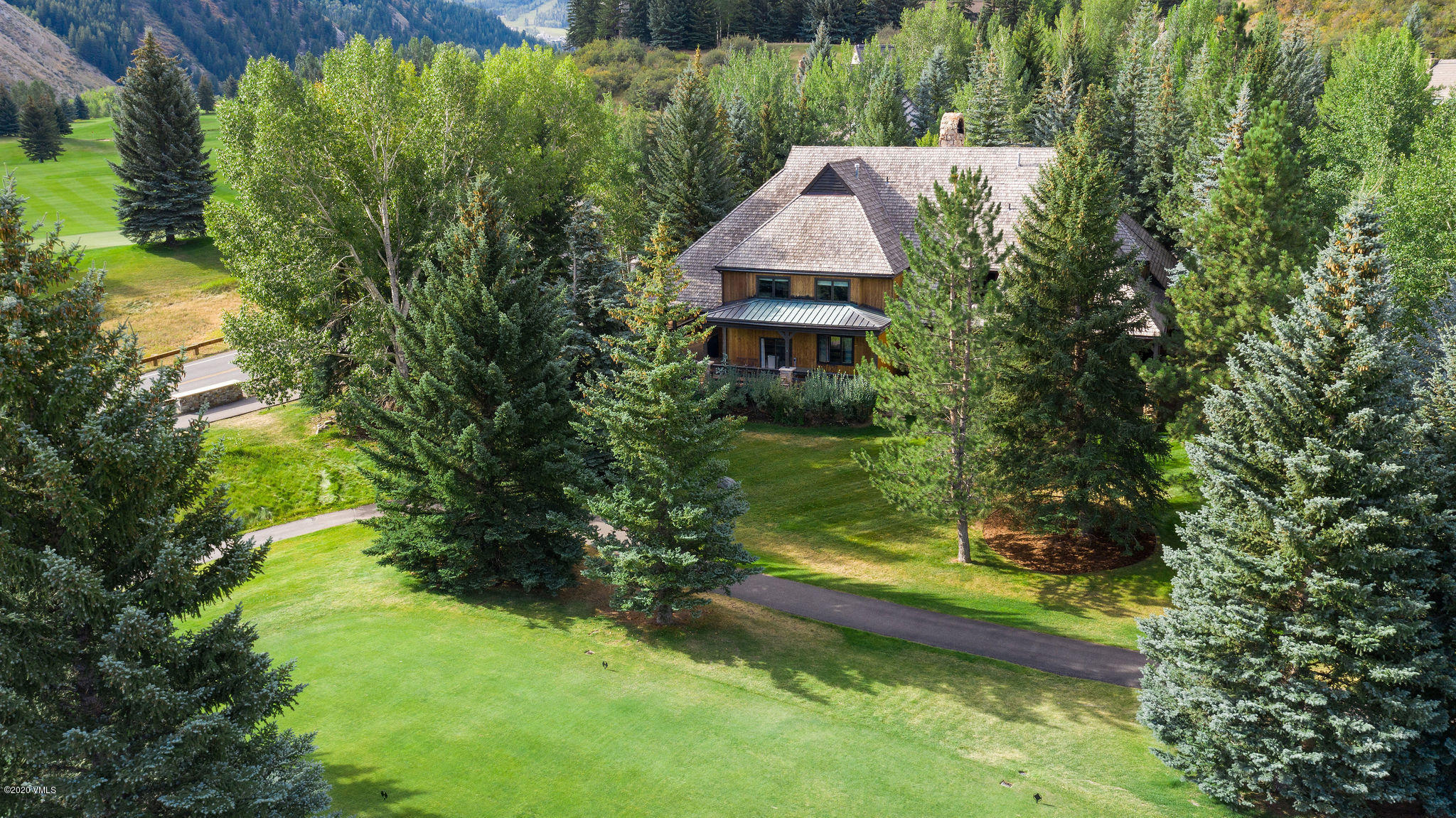 10 Bachelor Gulch Road Beaver Creek, CO 81620 - Photo 16 of 19 a aerial view of a house with swimming pool garden and patio
