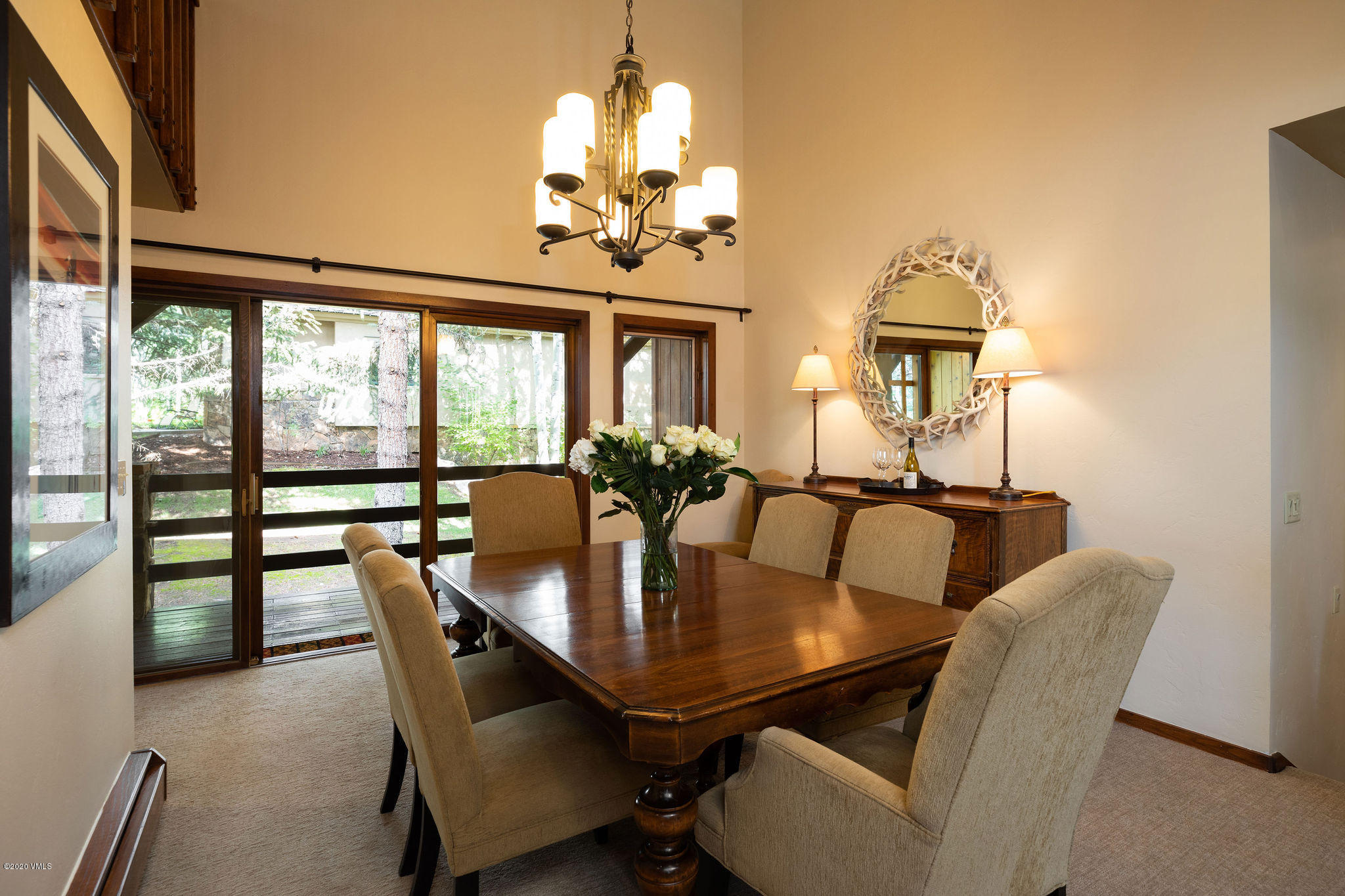 10 Bachelor Gulch Road Beaver Creek, CO 81620 - Photo 4 of 19 a view of a dining room with furniture a chandelier and wooden floor