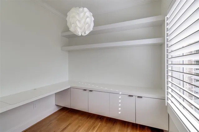 a bathroom with a shower sink and mirror