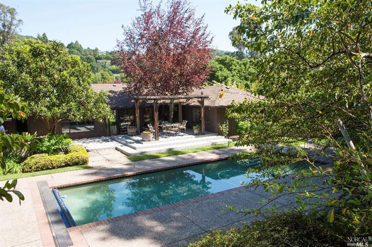 27 Legend Road San Anselmo, CA 94960 - Photo 1 of 1 a view of swimming pool with lawn chairs and plants