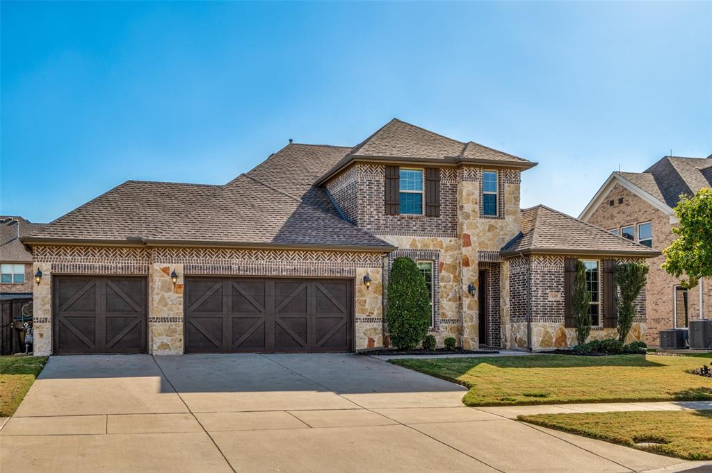 11409 La Salle Road Frisco, TX 75035 - Photo 1 of 23 a front view of a house with garden