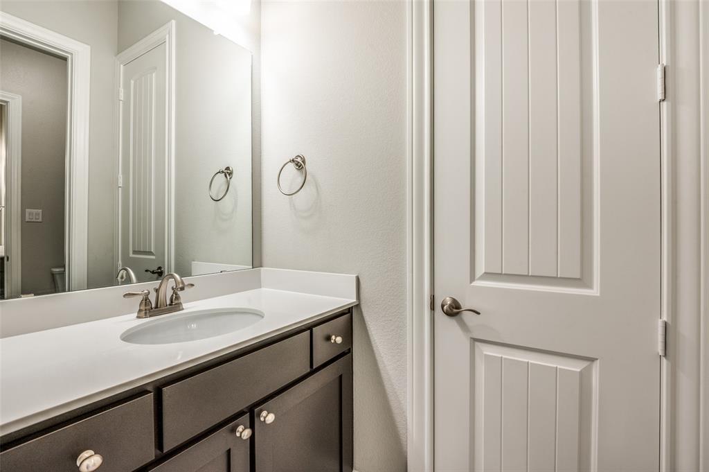 11409 La Salle Road Frisco, TX 75035 - Photo 15 of 23 a bathroom with a sink and a mirror
