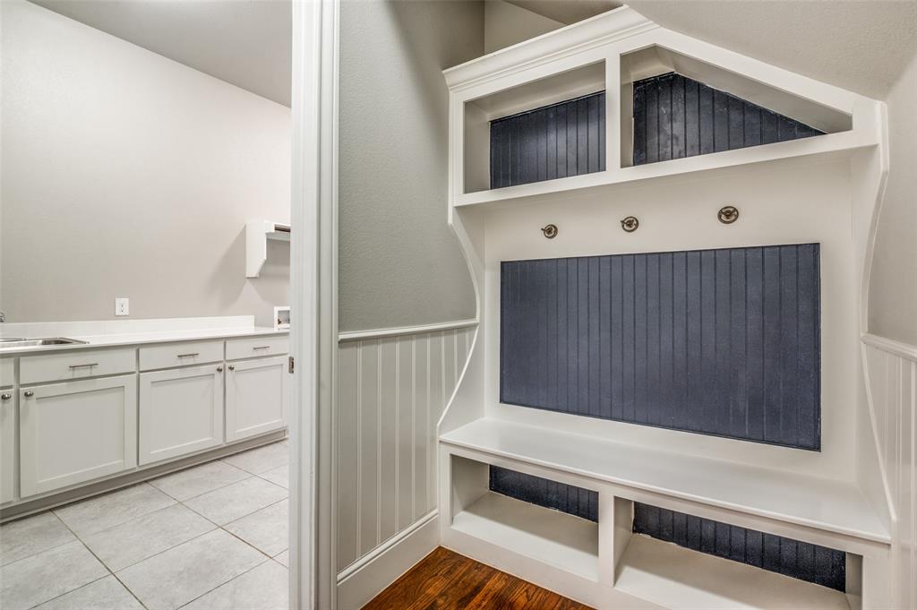 11409 La Salle Road Frisco, TX 75035 - Photo 17 of 23 a kitchen with white cabinets and white appliances