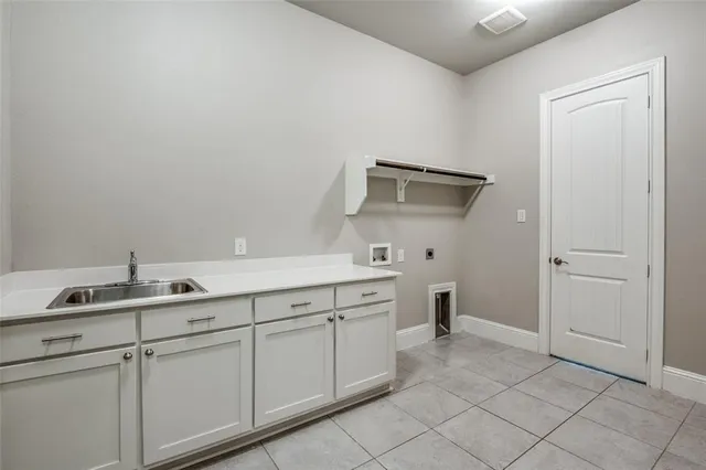 a kitchen with a sink and cabinets