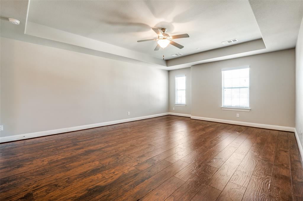 11409 La Salle Road Frisco, TX 75035 - Photo 19 of 23 an empty room with wooden floor and windows