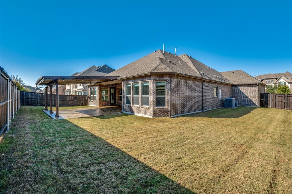 11409 La Salle Road Frisco, TX 75035 - Photo 21 of 23 a front view of a house with a garden