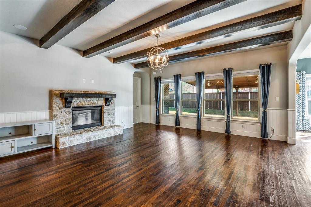 11409 La Salle Road Frisco, TX 75035 - Photo 7 of 23 a view of an empty room with wooden floor fire place