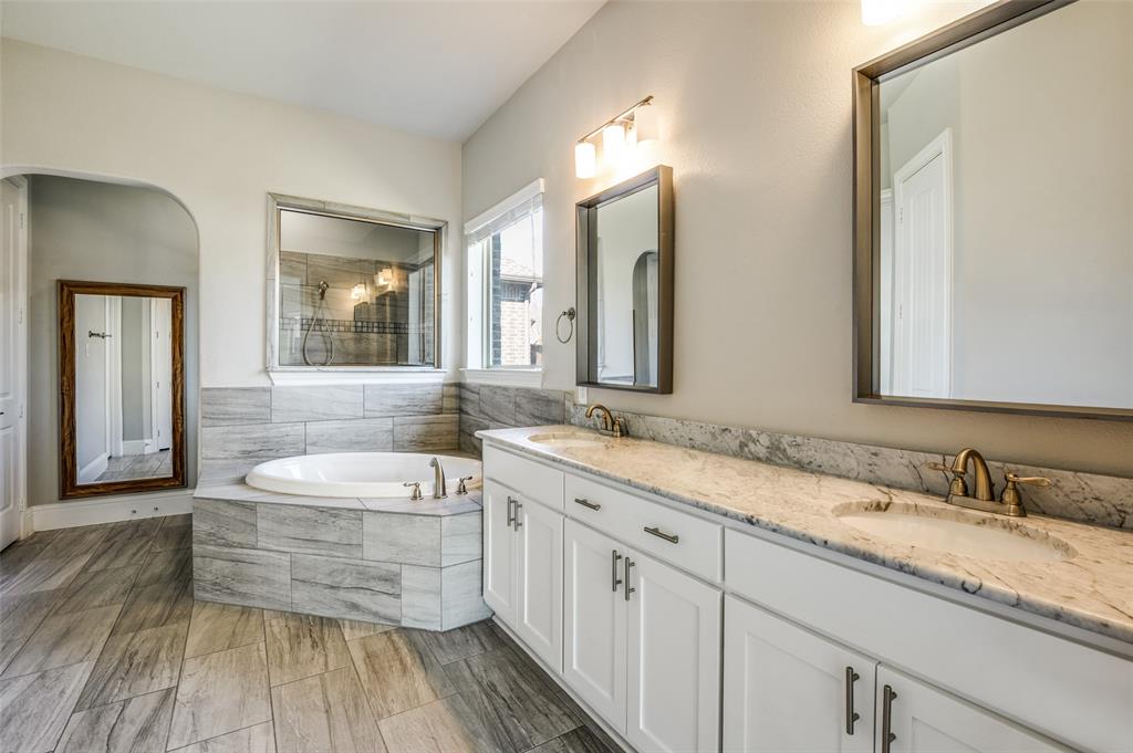 11409 La Salle Road Frisco, TX 75035 - Photo 10 of 23 a spacious bathroom with a double vanity sink a mirror and a