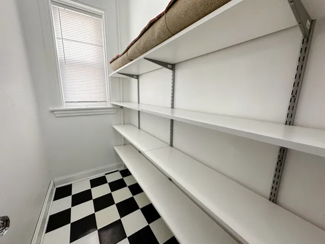 a bathroom with a bathtub sink vanity mirror and toilet