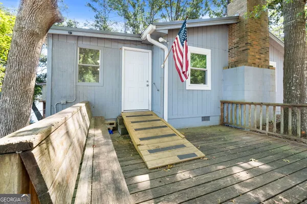 a room with pool table and a couch