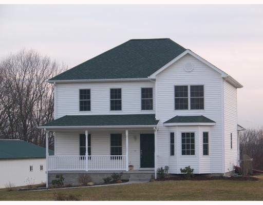 Exterior Front. Custom built by Stewart Homes this is a maintainance free home. All vinyl siding,facia, and railings. 200 amp service.