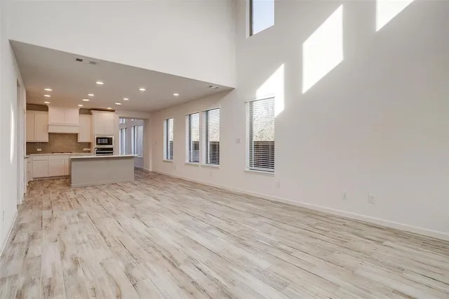 a view of kitchen and wooden floor