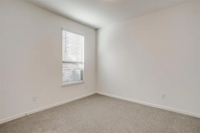 an empty room with closet area